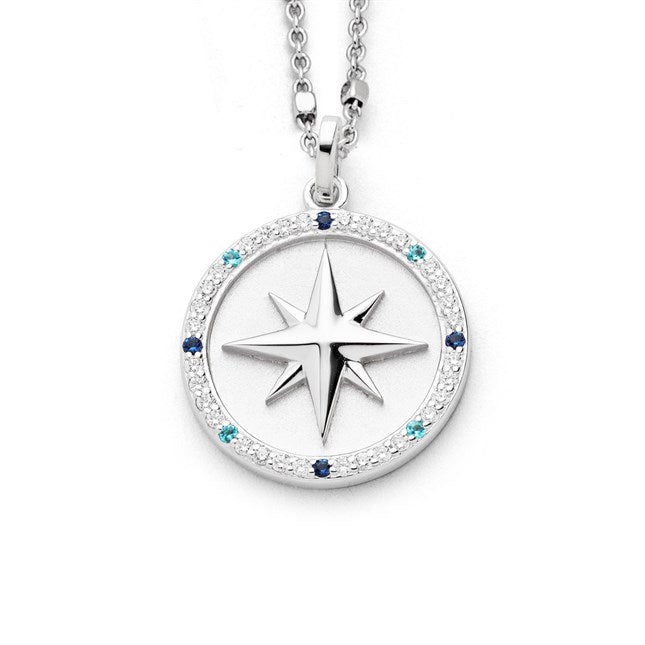 Anhänger "Kompassrose 2.0" aus rhodiniertem 925er Sterling-Silber, mit 40 Zirkoniasteinen in Weiß, Hellblau und Dunkelblau und mattierter Oberfläche im Inneren.